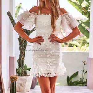 White, textured off the shoulder dress.